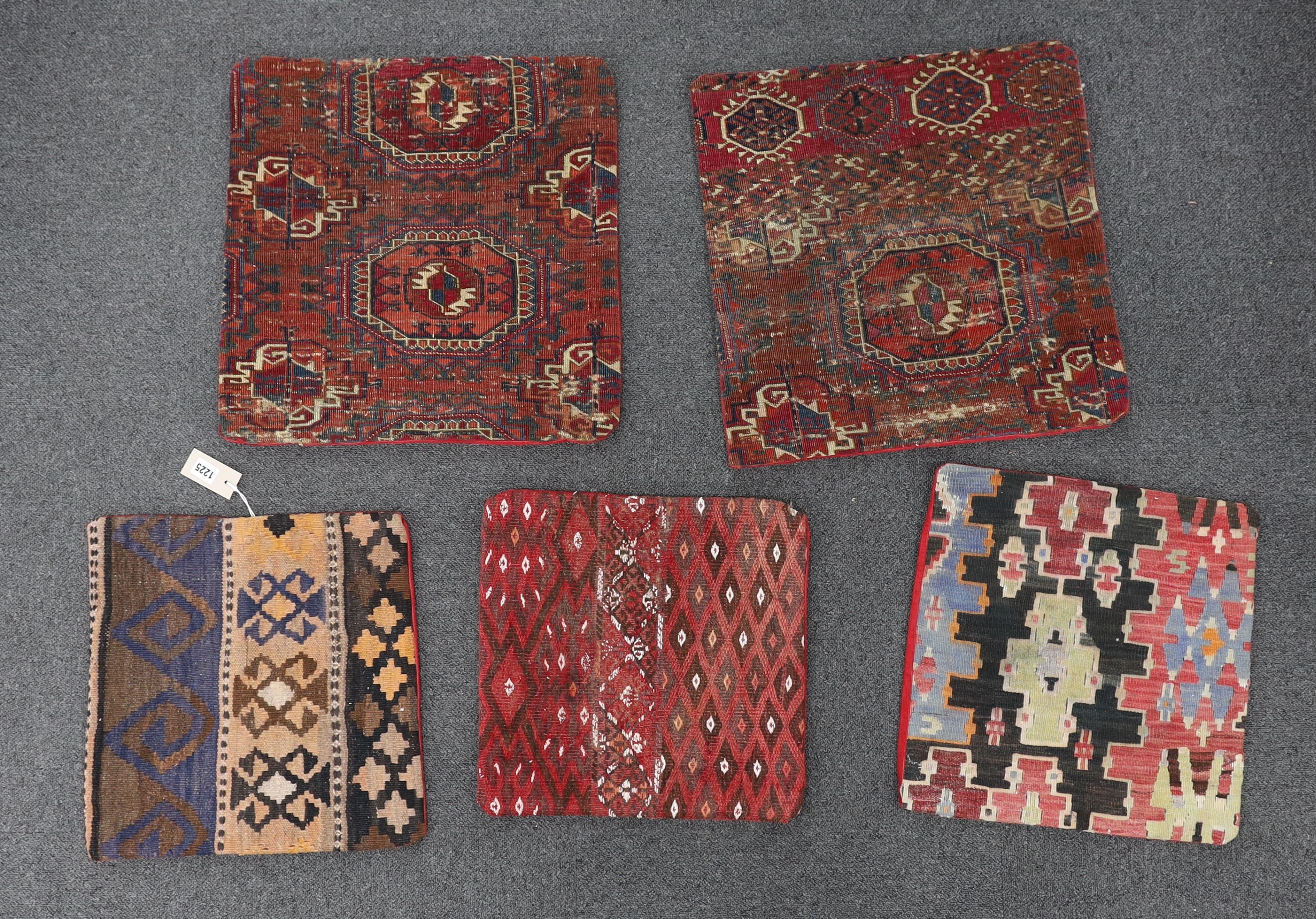 Five assorted Kilim and Tekke carpet cushion covers, largest 48 x 48cm